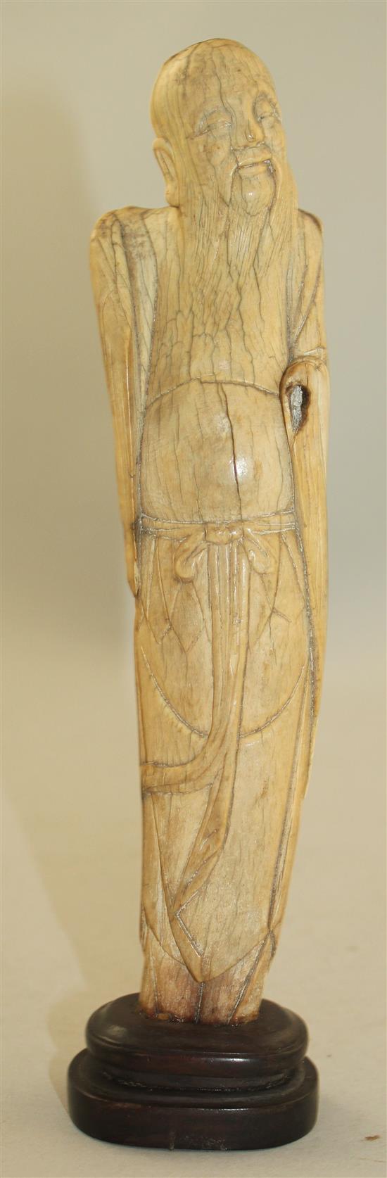 A Chinese ivory figure of an immortal, late Ming dynasty, height 21cm, slight losses and age cracks